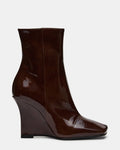 EVOQUE Brown Patent Slanted-Toe Wedge Women's Ankle Boot | Steve Madden